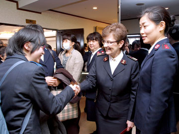 The General, with translator Lieutenant Miwa Nakajima, meets members of the congregation