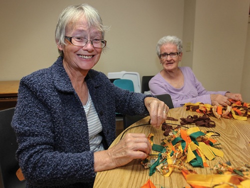 Linda Sutherland and Janice Wilson make seasonal wreaths at SA Connections