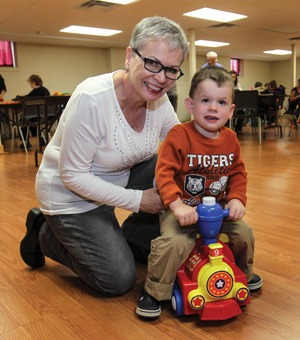 Carolyn Barnett and her great-nephew, Quinn, play together at SA Connections
