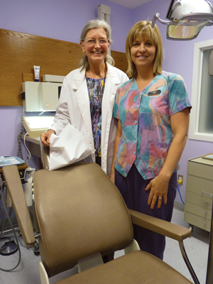 Dr. Dale Sellars and Lara Kahl, dental assistant, volunteer their services at Mouth Minders, a free Salvation Army dental clinic