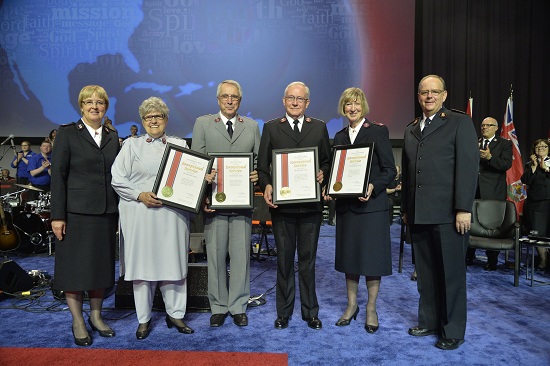 General André Cox and Commissioner Silvia Cox present Exceptional Service Awards to Colonels Marguerite and Robert Ward and Colonels Robert and Gwenyth Redhead