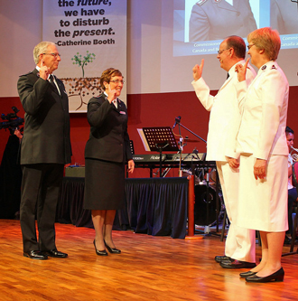 Commissioners Brian and Roaslie Peddle salute international leaders, General André Cox and Commissioner Silvia Cox (World President of Women's Ministries) at the International Conference of Leaders 2014