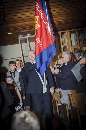 Cadet Keith Hopkins carries the Messengers of Light sessional flag