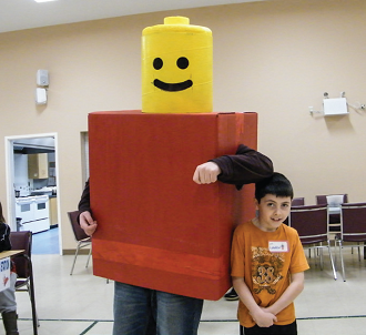 Landon enjoys a moment with the Lego Man at junior youth councils