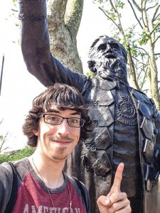 Photo of Daniel Schriver posing with statue of William Booth