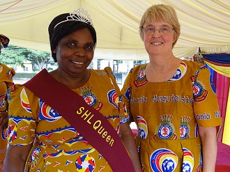 Commissioner Silvia Cox shares a moment with a Salvationist at a women's rally in Dar es Salaam