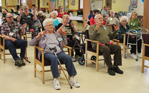 Residents and day-program participants join in a Zumba class