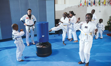 Taekwondo students practising