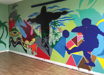 A colourful graffiti-style vista of Rio adorns the Méier dance studio wall