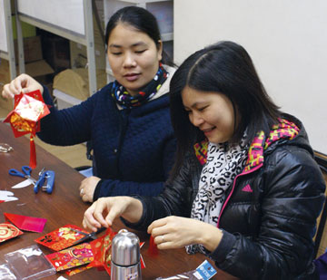 Photo of women making decorations for Chinese New Year 