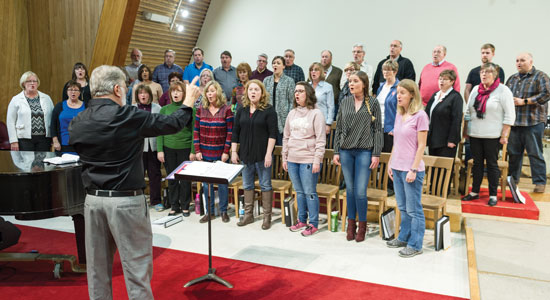Major Len Ballantine leads the Canadian Staff Songsters in rehearsal
