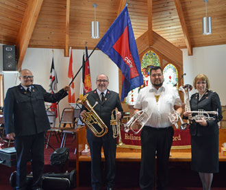 Lt-Col Brian Venables and Commissioner Susan McMillan dedicate new instruments at the Gitwinksihlkw Corps