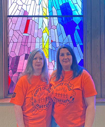 From left, Carrie Stevens, a member of the leadership team at Niagara Orchard CC, and Mjr Nancy Braye, CO, mark Orange Shirt Day