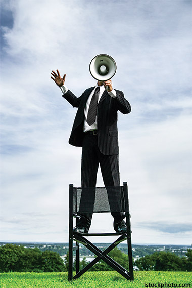 Photo of man with megaphone to illustrate the need for a spiritual wake up call