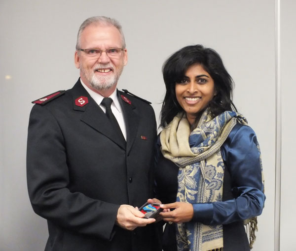 Major Roy Langer receives a medal from the town of Slave Lake, Alta.