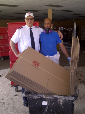 Colonel Mark Tillsley, chief secretary, assists with flood relief efforts in High River, Alta.