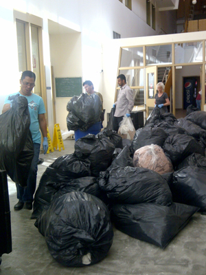 Volunteers and staff clean up Calgary's Centre of Hope in preparation for its reopening