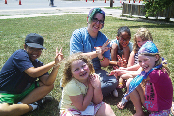 Camp at Home staff member Colleen Wright visits with children in London, Ont.