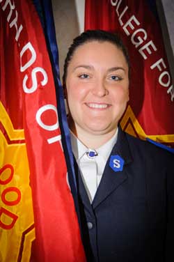 Cadet Stephanie Sawchuk with the Heralds of Grace sessional flag