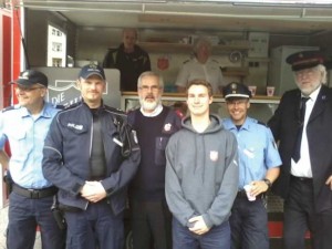 Markus Beveridge (centre) with staff and volunteers with the mobile canteen