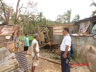 A Salvation Army officer visiting a community in Antique devastated by Typhoon Haiyan