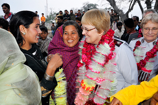 Commissioner Silvia Cox receives a garland