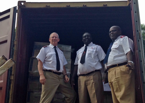 Supplies arrive at Howard Hospital. Commissioner Brian Peddle (left) is on hand to help with the container