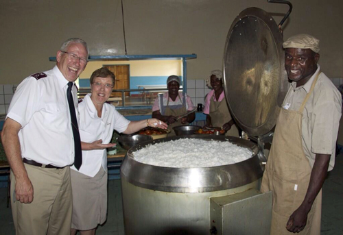 Workers prepare lunch for 650 children at the Mazowe Boys' High School