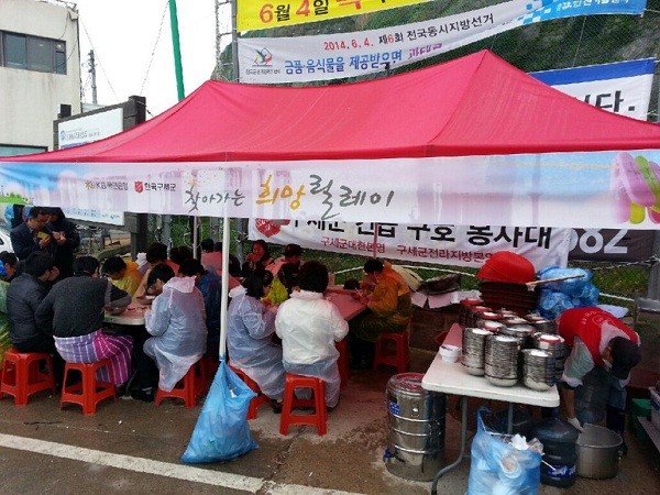 People take shelter in a Salvation Army food tent