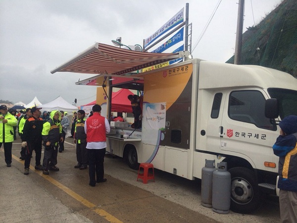 A Salvation Army food truck serves emergency workers