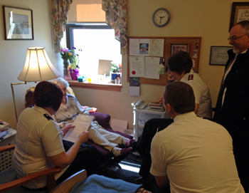 Cadets visiting a shut-in in Brantford with Majors Guy and Donna Simms, corps officers