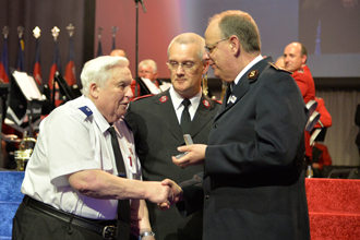 General André Cox presents Charles Reid with his fifth Silver Star