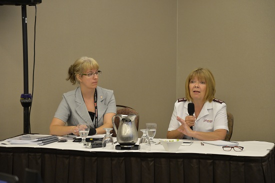 Diana Bussey and Major Anne Read share at a workshop on human trafficking