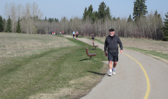 Allan Kellett walks a path near the reservoir in Calgary