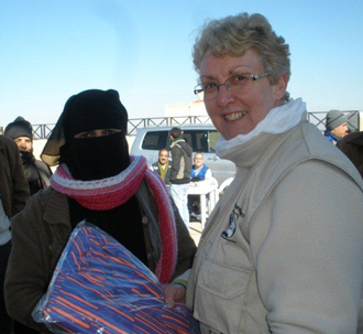 Major Alison Thompson distributes winterization kits in Jordan
