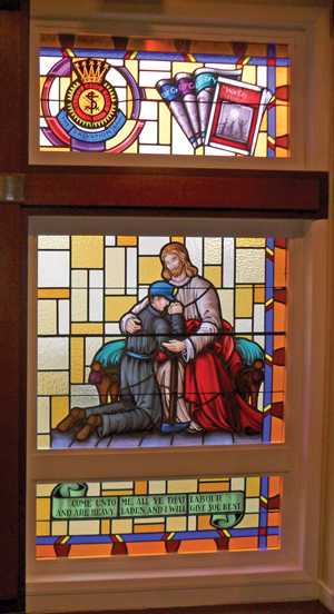 A stained glass window at Glace Bay Corps, inspired by the Army's ministry in mining communities