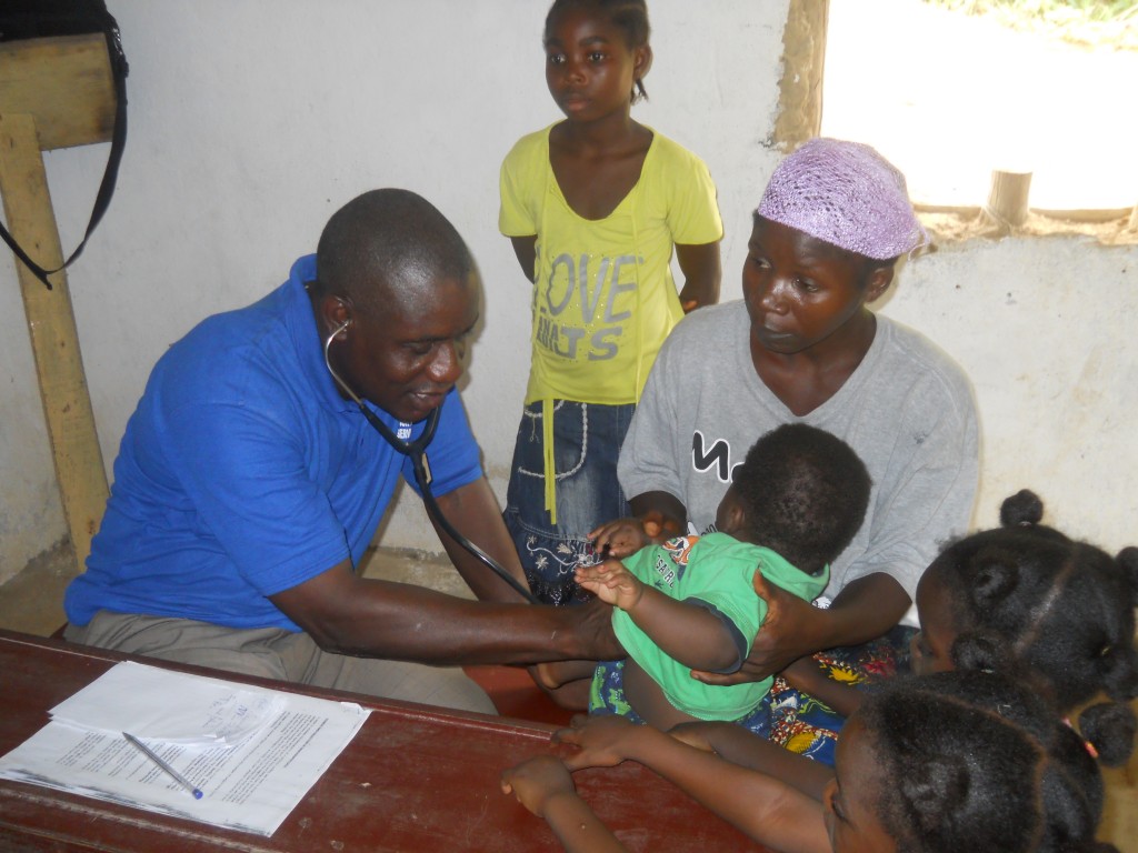 Mobile Medical Clinic Dr. provides children and mother with medical check-ups. (2014 Partners in Mission trip)