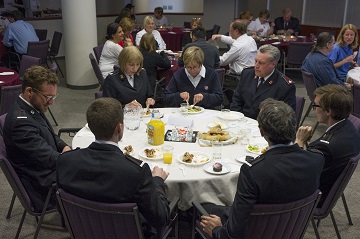 Commissioner Susan McMillan, territorial commander, Lt-Colonel Debbie Graves, integrated missions secretary and Lt-Colonel Lee Graves, secretary for business administration enjoy lunch with the Venables brothers, guest musicians from North York Temple