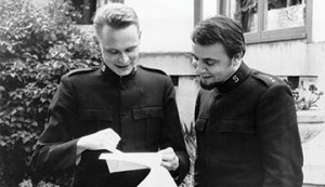 Photo of John Larsson and John Gowans discussing a script