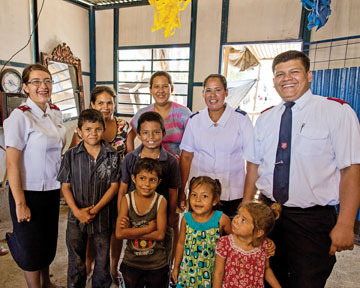 Photo of Lieutenants Alvaro and Vanessa Vargas and people from community