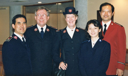 Robert and Gwenyth with members of the Japanese Staff Band in Wellington, New Zealand, in 1998