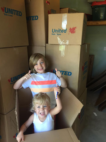 Photo of Jackson and Adelaide with moving boxes