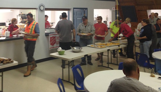 Salvation Army personnel serve lunch to 130 people in Arborfield, Sask.