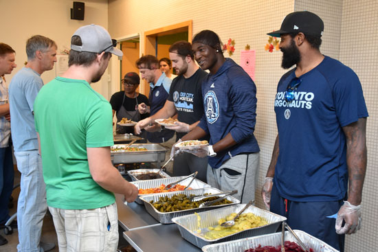 The Argos interact with fans while serving