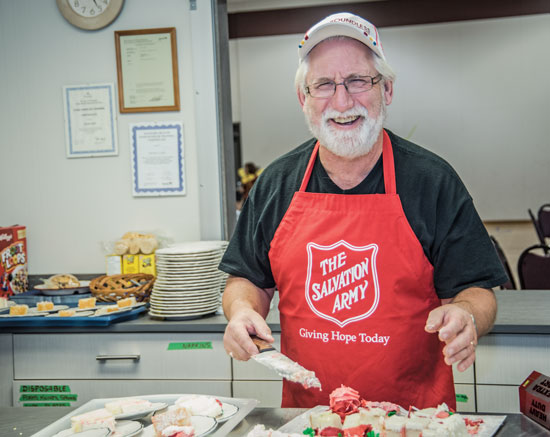 Wally Clarke prepares a meal for Kids Klub.