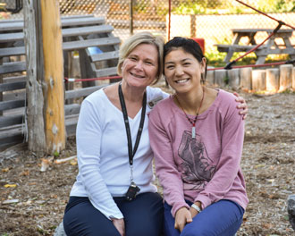 Mjr Erin Verhey and Peipei Dai in the playground at the Bethany Hope Centre. Dai says Mjr Verhey is like a “mom” to her