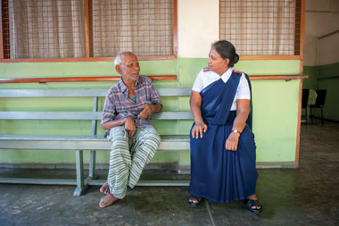 Major Shanti Seneviratne stops to talk to a resident of the Rajagiriya Iris Perera Elders Home. 