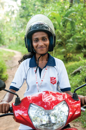 Salvation Army community development workers in Pollonaruwa visit remote areas by motorcycle to assess community needs. A mobile medical clinic is dispatched to test for illnesses related to contaminated water supplies.