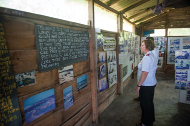 Major Brenda Murray, director of world missions, pauses to reflect at a museum of photos, taken by survivors, that show the devastation the tsunami caused.