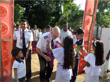 Mjr Peter McGuigan and Cpt Tara McGuigan receive a traditional welcome